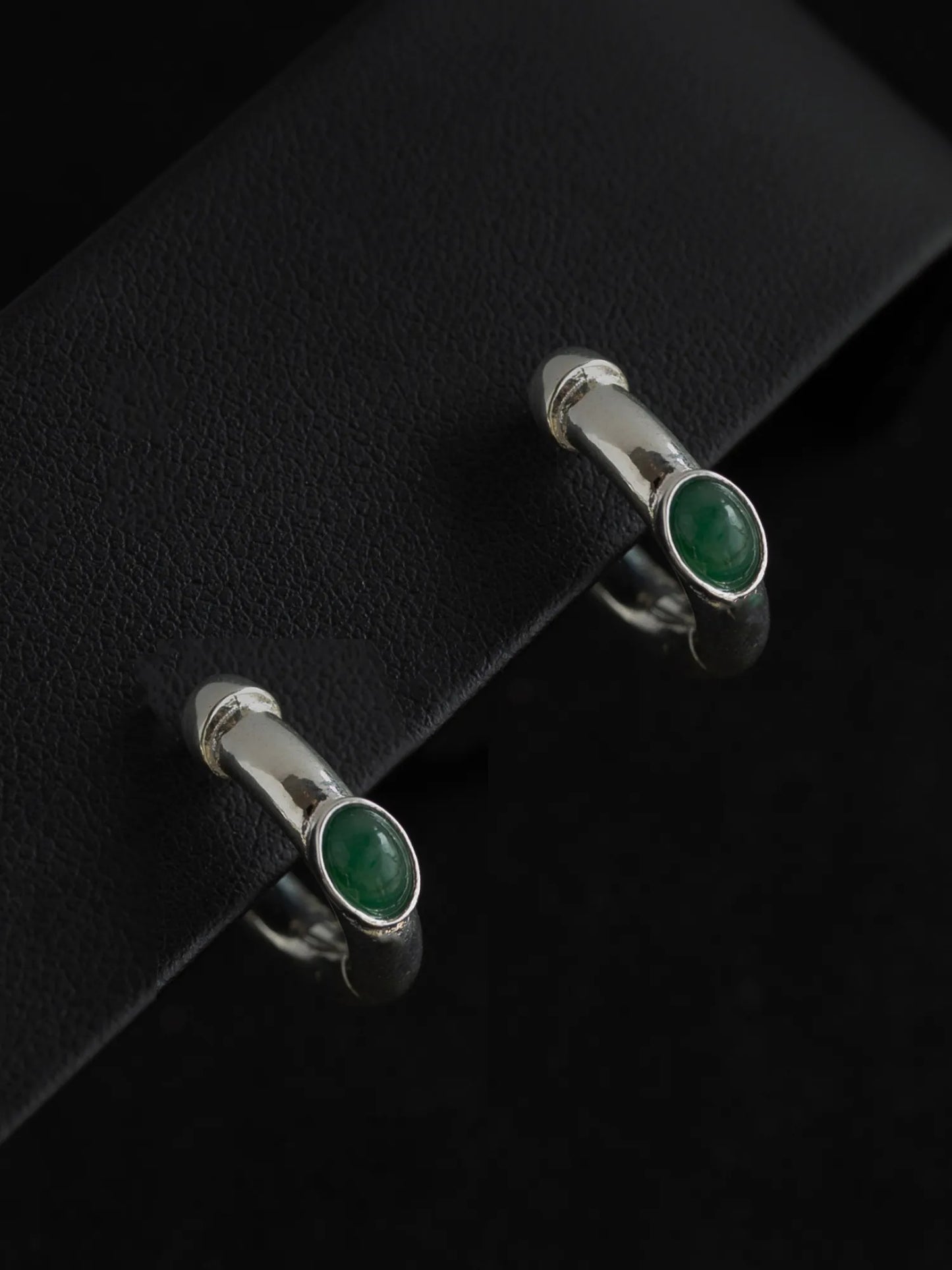 Maancy Day and Night Reversible Hoop Earrings with jade gemstones on black leather, showcasing the transformable silver jewelry design.