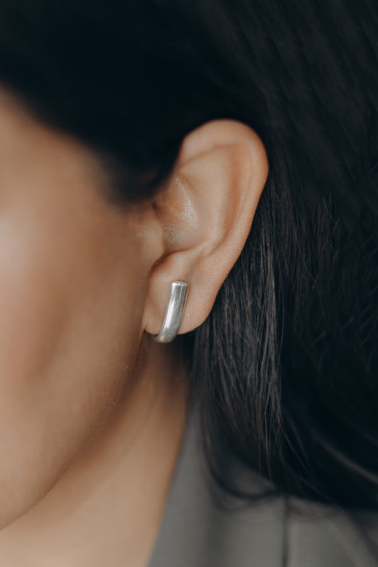 Sterling Silver earrings that cuff the earlobe in a half moon shape