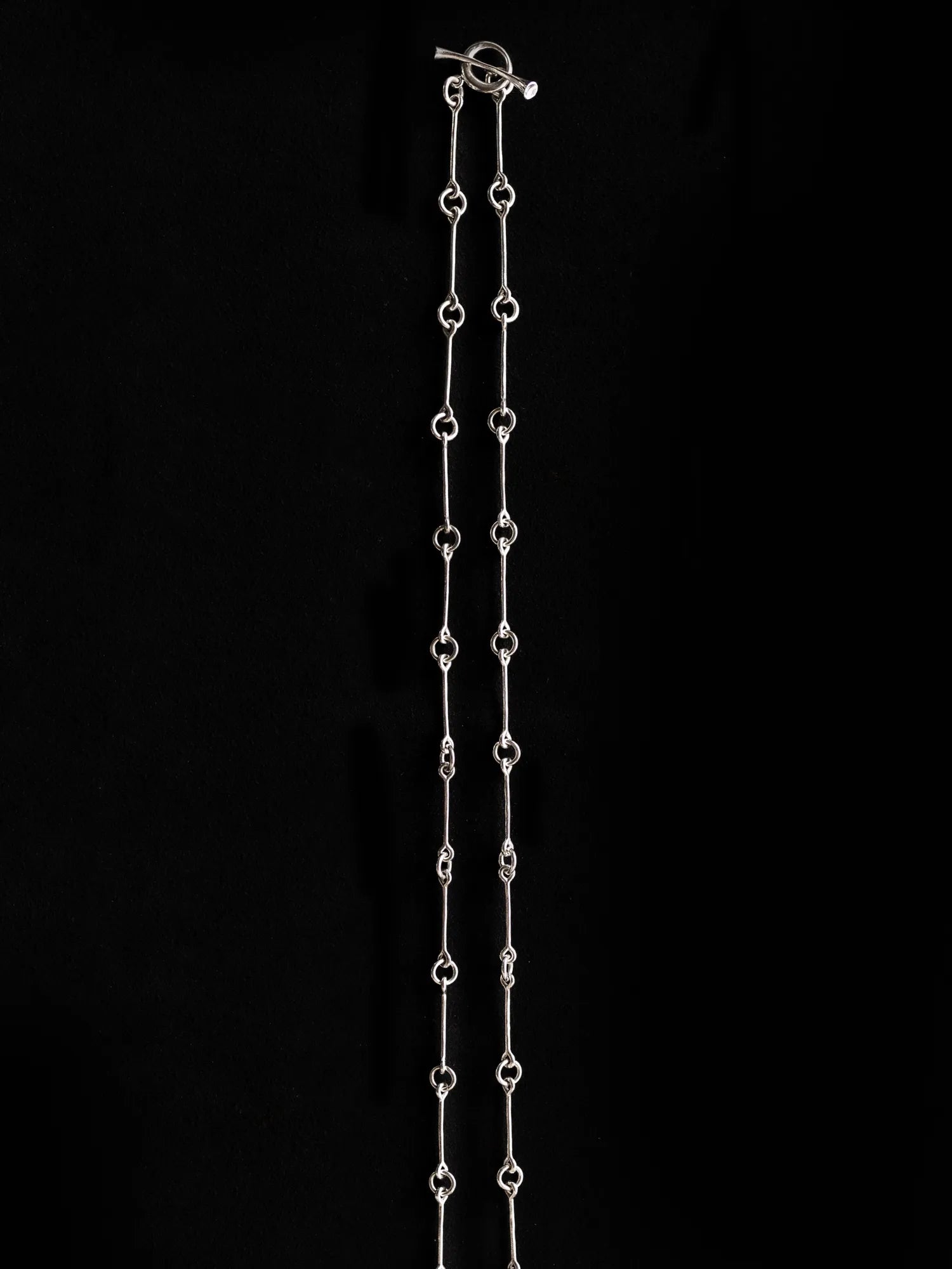 Maancy handcrafted sterling silver chain necklace with toggle clasp, featuring artisan-made connecting links in full-length display.