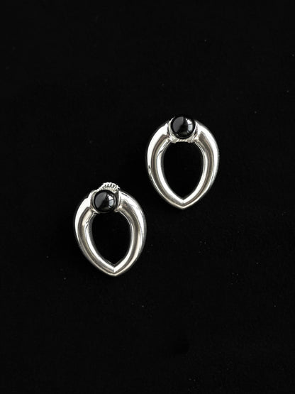 Maancy sterling silver teardrop stud earrings with onyx gemstones, designed as versatile 8mm studs compatible with interchangeable earring system.