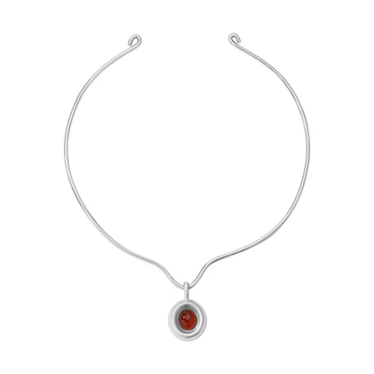 Silver scroll necklace with carnelian pendant on a white background